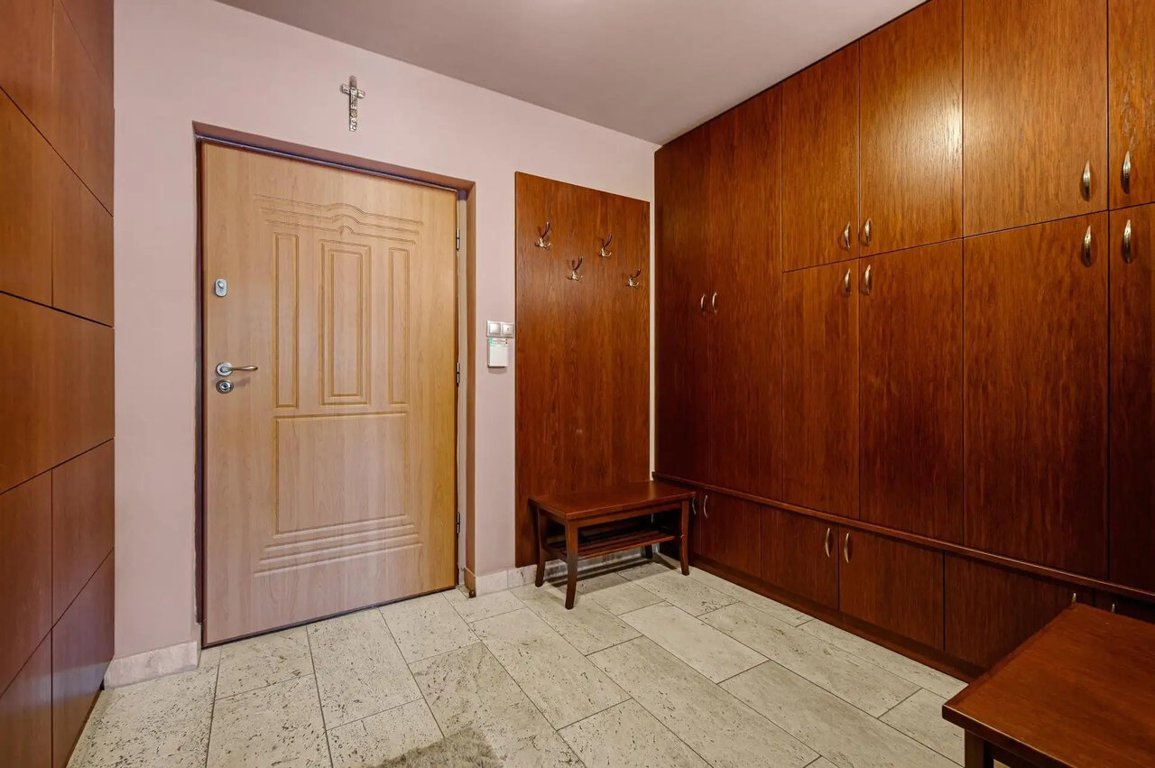 Tidy hallway with built-in wardrobe