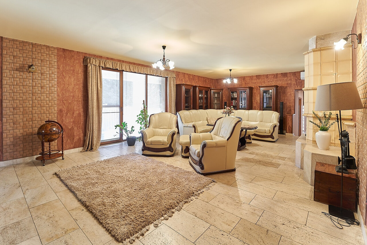Elegant living room with classic furniture and tile stove