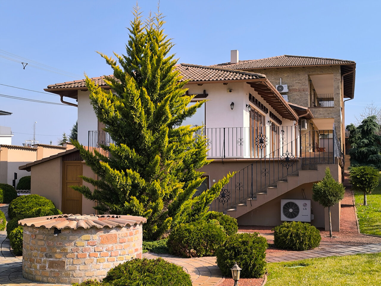 Mediterranean house facade with manicured garden
