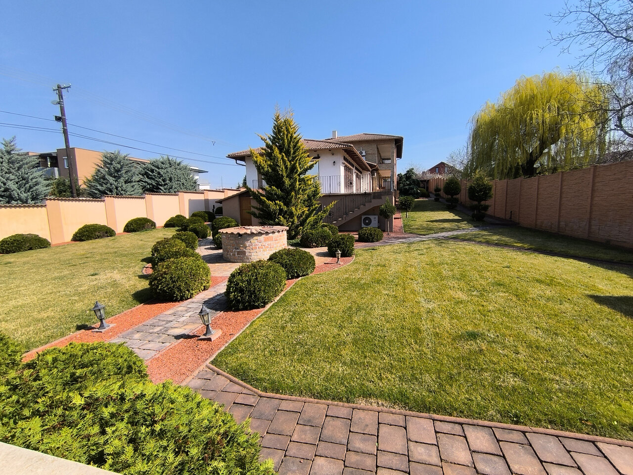 Spacious garden with outdoor oven and lights