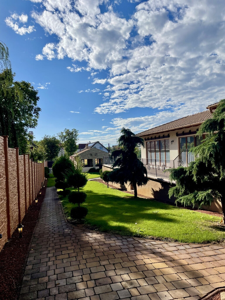 Manicured garden section with paved walkway